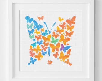 Peut inclure: Impression encadrée représentant un papillon composé de nombreux petits papillons. L'œuvre utilise un effet aquarelle avec une palette de bleus, d'oranges, de jaunes et de verts. L'impression est sur fond blanc.