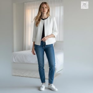 May include: A woman wearing a white blazer with three-quarter sleeves, a black top, and blue jeans. She is also wearing white sneakers. The background includes a bed and a window with white curtains.