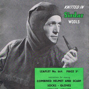 May include: A black and white photo of a person wearing a knitted hat and scarf. The text on the image reads "More 'Comforts' for the Forces, Knitted in Sirdar Wools, Leaflet No. 869. Price 3d. Instructions for making Combined Helmet and Scarf, Socks Gloves, Service Helmet, Harrap Bros. (Sirdar Wools) Limited. Wakefield."
