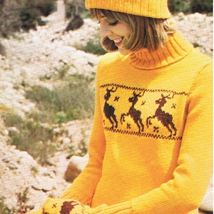 May include: A yellow knitted sweater with a brown deer pattern and a matching yellow knitted hat with a brown deer pattern and a brown pom pom.