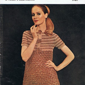 May include: A vintage crochet pattern booklet featuring a woman wearing a brown and white crochet dress. The cover features the text "Barbara Warner Couture Crochet" and "C59 1/3 (6p)".