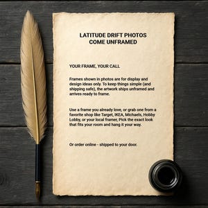 May include: A vintage-style image featuring a quill pen, inkwell, and a parchment paper with text: "LATITUDE DRIFT PHOTOS COME UNFRAMED". The items are arranged on a dark wooden surface.