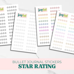 May include: Four sheets of star rating stickers in various colors, including black, gray, orange, and pink. Each sheet has multiple rows of star outlines. The stickers are labeled "joyful design co." and "Bullet Journal Stickers Star Rating."