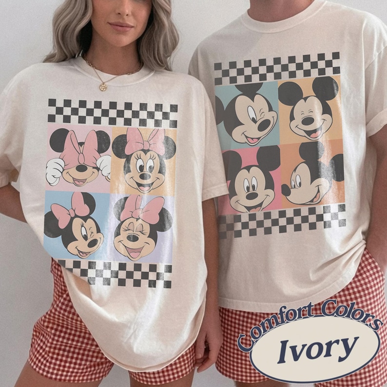 May include: Ivory-colored t-shirts featuring Mickey and Minnie Mouse designs. The shirts have a checkerboard pattern and are paired with red and white checkered shorts. The text "Comfort Colors Ivory" is visible.