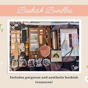 May include: A collection of stationery and reading accessories including a brown notebook, a daily planner, various bookmarks, stickers featuring stacks of books, a small acorn-shaped item, a rainbow charm, pens, and sticky note tabs arranged together.