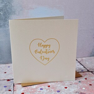 Biglietto d'auguri in lamina d'oro a forma di cuore per San Valentino