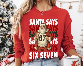 Sudadera navideña retro con el lema "Santa dice seis siete", camiseta divertida de Santa Claus, camiseta con meme viral de internet, camiseta navideña divertida, camiseta 67