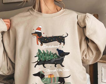 Sudadera navideña de perro salchicha, camiseta navideña de perro salchicha, regalo para amantes de los perros, perro salchicha en la nieve, cuello redondo navideño, camiseta para mamá perro salchicha