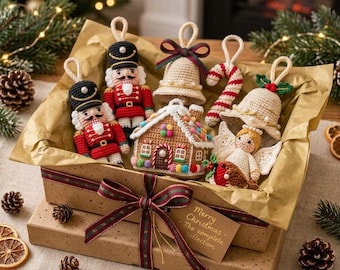 May include: A collection of crocheted Christmas ornaments in a gift box, including two nutcrackers, a gingerbread house, two bells, a candy cane, and an angel. A tag on the box reads Merry Christmas - The complete collection.