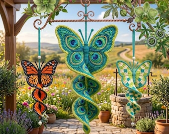 May include: Three hanging crochet butterfly ornaments with spiral tails. The left is orange and black, the center is teal and green with peacock-like eye patterns, and the right is light green and white. A banner at the top reads TÉLÉCHARGEMENT PDF.