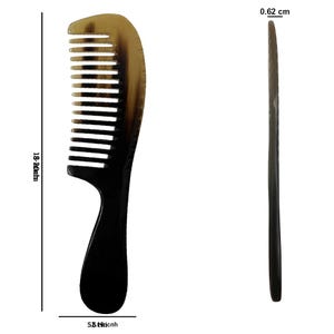 May include: A two-toned comb with a curved handle. The comb is 7.2 inches long and 2.1 inches wide, with a thickness of 0.24 inches. The comb's teeth are black, and the top is a light brown color.