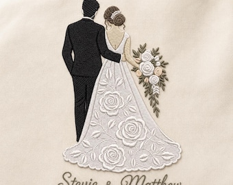 May include: An embroidered design on cream fabric featuring a couple standing side by side. The figure on the left wears a black suit, while the figure on the right wears a white gown with rose patterns and holds a bouquet. The text reads Stevie & Matthew.