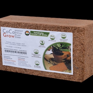 May include: A rectangular block of sustainable coconut coir bricks, ideal for all plant types. The product features a white label with text and graphics, including "CoCo Grow" and "Sustainable Coconut Coir Bricks". The coir brick is a natural and organic growing medium.