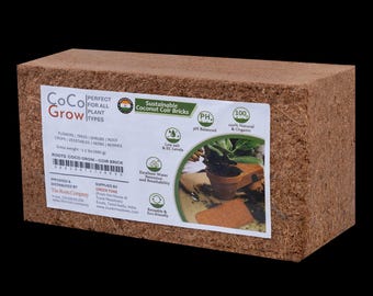 May include: A rectangular block of sustainable coconut coir bricks, ideal for all plant types. The product features a white label with text and graphics, including "CoCo Grow" and "Sustainable Coconut Coir Bricks". The coir brick is a natural and organic growing medium.