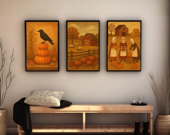 May include: Three framed autumn-themed prints. The first features a black crow perched on pumpkins. The second depicts a red barn and pumpkins. The third shows women harvesting pumpkins. All are in black frames.