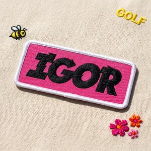 Pink Rectangular Embroidered Patch, Bold Black Lettering Iron on Patch for Backpacks, DIY Clothing Decoration Gift, Trendy Jacket Accessory