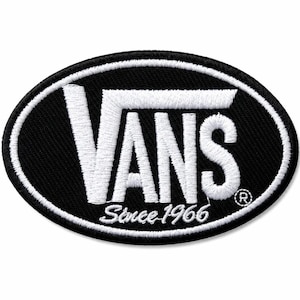 May include: An oval-shaped embroidered patch featuring a black background with a white border. The white text reads VANS in a bold, stylized font, with the words Since 1966 written below in a smaller script font and a registered trademark symbol.