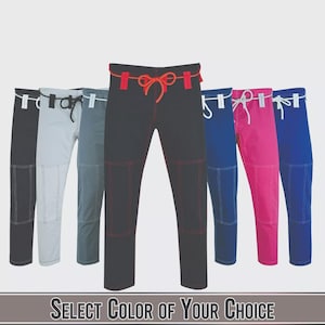 May include: A selection of martial arts pants in various colors, including black, gray, blue, and pink. Each pair features reinforced stitching and a drawstring waist. The text "SELECT COLOR OF YOUR CHOICE" is displayed at the bottom.