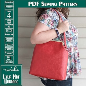 May include: A red handbag with a gold clasp and a shoulder strap. The bag is made of a textured material and has a simple, classic design. The bag is being held by a person wearing a floral shirt and jeans. The image includes the text "LYLA MAY HANDBAG" and "toriska PATTERNS".