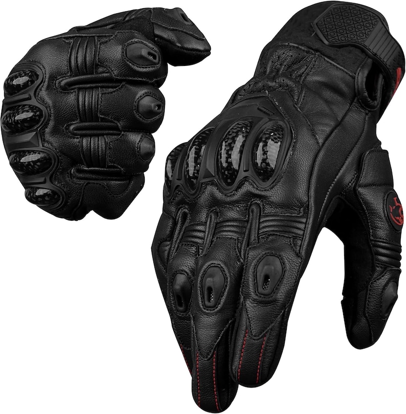 May include: Black motorcycle gloves with carbon fiber knuckle protection and red stitching. The gloves have a textured grip on the palm and fingers. The gloves are made of leather and have a secure wrist closure.