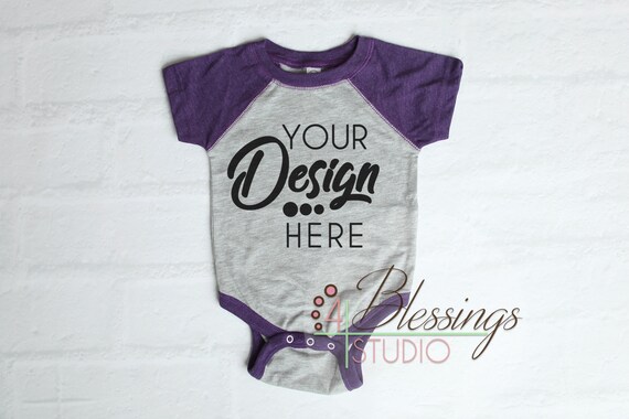 Raglan Bodysuit Mockup Blank Purple And Vintage Heather Baby Raglan Bodysuit Mockup Blank Purple And Vintage Heather Baby