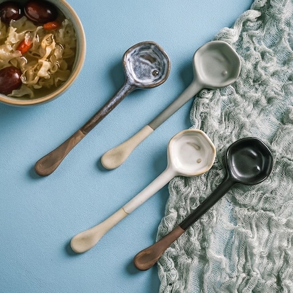 Heat-resistant Japanese ceramic spoons in 5 artistic glazes — they double as tabletop decor and are the kind of thing you buy one of and end up buying five.