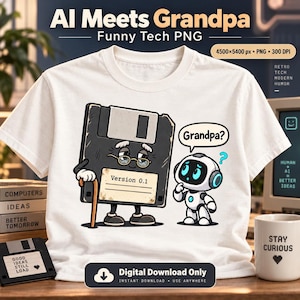 May include: A white t-shirt featuring a graphic of a black floppy disk character with glasses and a cane, labeled Version 0.1, standing next to a small white robot. The robot has a speech bubble that says Grandpa? with a blue question mark.