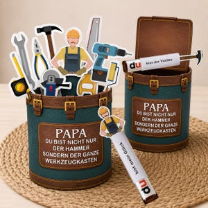 May include: Two teal and brown decorative toolboxes with the text "PAPA" and German text. The toolboxes are filled with tool-themed cutouts, including a hammer, saw, and drill. One toolbox has an open lid.