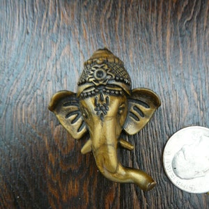 small bronze coloured ganesh tiny ganesh traveling altars remover of obstacles hindu god lucky elephant