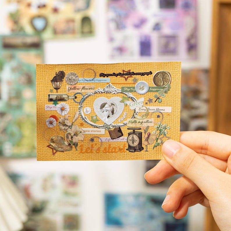 May include: A decorative sticker sheet with a vintage aesthetic. The sheet features a heart-shaped frame, floral elements, and various embellishments in shades of yellow, white, and green. Text includes "Yellow flowers" and "Let's start".