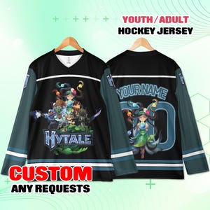 May include: Black hockey jersey with teal sleeves and white stripes. The front features a graphic of characters and the word "HYTALE". The back has a character graphic and space for a name and number. Text reads "YOUTH/ADULT HOCKEY JERSEY" and "CUSTOM ANY REQUESTS".