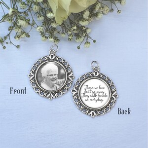 May include: Silver memorial charm with a photo on the front and a quote on the back. The quote reads "Those we love don't go away. They walk beside us everyday."