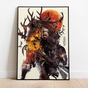 May include: Framed art print featuring a fantasy illustration with a central figure holding a sword, set against a backdrop of a fiery landscape and a large red moon. The Witcher Wild Hunt logo is visible.