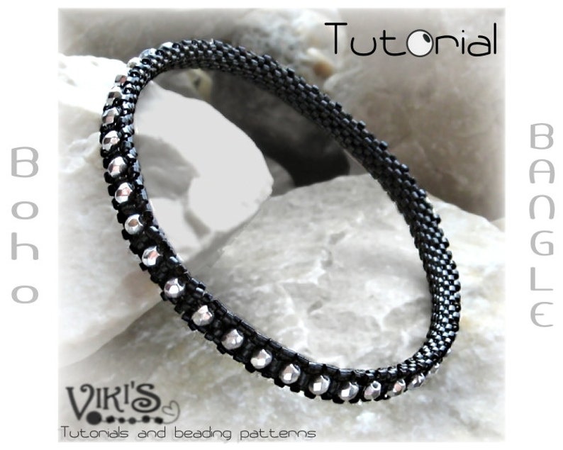May include: Black beaded bangle bracelet with silver-colored accents. The bracelet is labeled "Boho Bangle Tutorial" and features the text "Viki's Tutorials and beading patterns."
