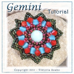May include: A beaded starburst design with red, light blue, and green beads. The center features a large, round, light blue bead. The word "Gemini" is at the top, with "Tutorial" next to it. Copyright 2011 - Viktoria Szabo is at the bottom.