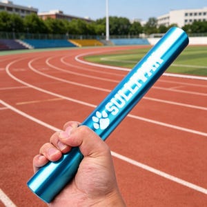 May include: A blue relay baton with the word "SULLIVAN" in white lettering and a paw print logo. The baton is held in a hand against the backdrop of a running track.
