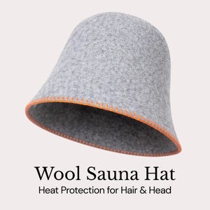 May include: A gray wool sauna hat with an orange stitched trim. The hat is bell-shaped and designed to protect hair and head from heat. The text "Wool Sauna Hat" and "Heat Protection for Hair & Head" are displayed below the hat.
