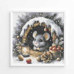 May include: A framed print featuring a cute gray mouse nestled in a cozy winter scene. The mouse is in a wooden shelter with snow, a lantern, and a small wooden bucket filled with red berries. Pine cones and snow complete the winter theme.