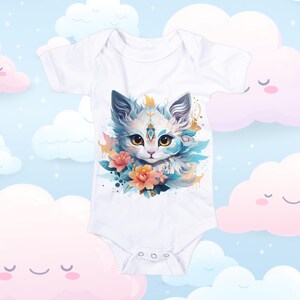 May include: White baby bodysuit featuring a watercolor illustration of a cat with blue and gold accents, surrounded by orange flowers. The cat has large yellow eyes and a serene expression. The background is a light blue with cartoon clouds.