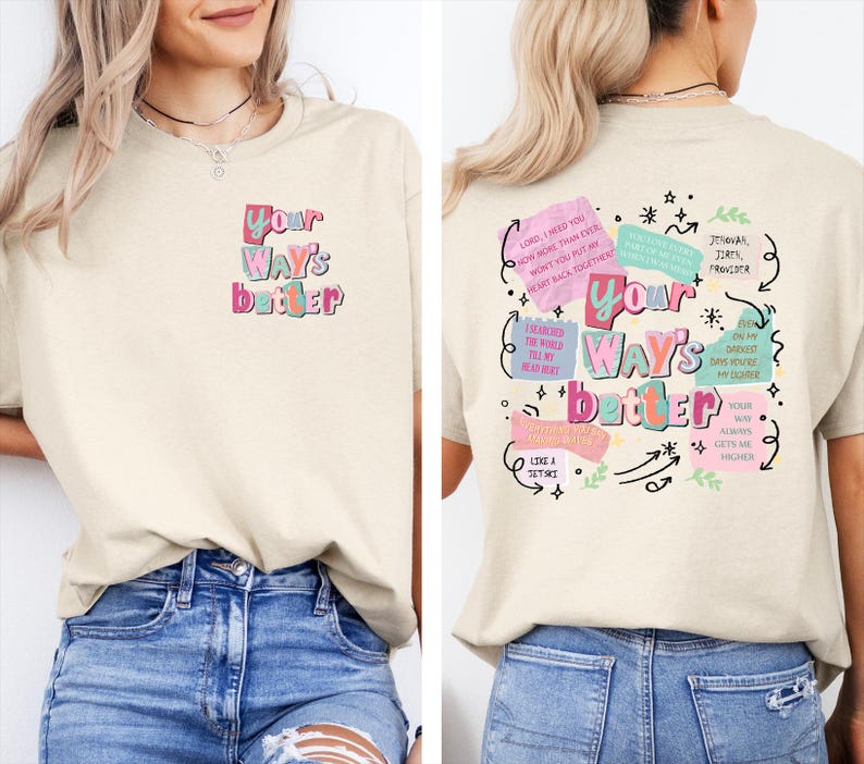 May include: Cream-colored t-shirt with the text "Your Way's Better" in colorful, stylized lettering on the front and back. The back features additional text and graphics in a similar style, including phrases and arrows.