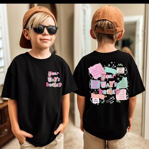 May include: Black t-shirt with the text "Your Way's Better" on the front and back. The front design is in pink, green, and blue. The back design includes multiple colorful text boxes with inspirational quotes.