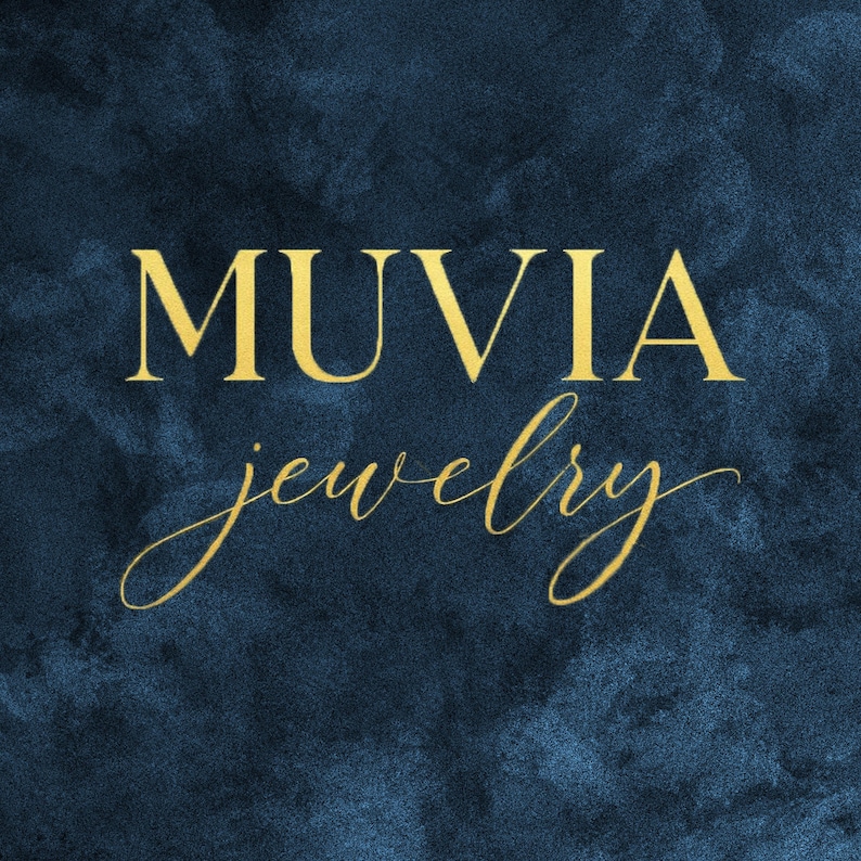 the word "MUVIA" in a stylized font, with the word "jewelry" below it, against a dark blue background.