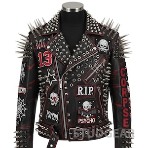 May include: Black leather jacket with red accents, adorned with silver studs and long spikes. Features patches with the number 13, a star, skulls, and the words "PSYCHO" and "CORPSE". A bold, edgy fashion statement.