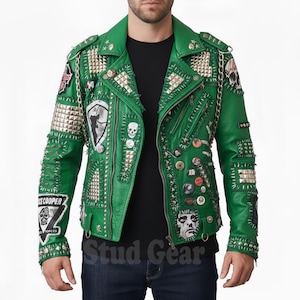 May include: A vibrant green leather jacket with silver studs, spikes, and patches. The jacket features multiple zippers, decorative chains, and various embroidered patches with skull and face designs. The sleeves and shoulders are heavily embellished.