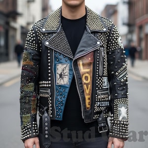 May include: Black leather jacket with silver studs and patches. Features the word "LOVE" and "PIXIES" on the front. The jacket has a classic biker style with a notched collar and asymmetrical zipper.