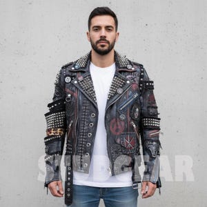 May include: Black leather jacket with silver metal studs and patches. The jacket features a studded collar, epaulets, and cuffs. Patches include a skull, the anarchy symbol, and other designs. The jacket has a zipper closure and a belt.