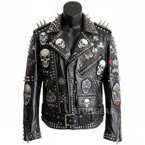 May include: Black leather jacket with silver spikes and skull patches. The jacket features a classic biker style with a notched collar, asymmetrical zipper, and a studded belt. Patches include various skull and monster designs.