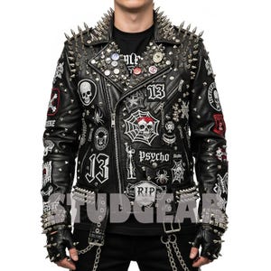May include: Black leather jacket with silver spikes on the collar, shoulders, and cuffs. The jacket is adorned with patches featuring skulls, spiders, and the number 13. The word "PSYCHO" is also visible on the jacket.
