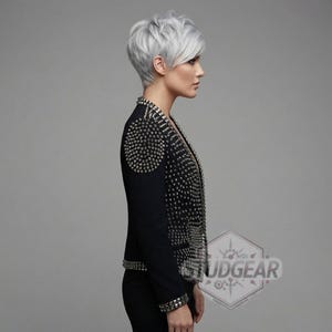 Side profile of studded leather jacket showing slim fit and arm detailing