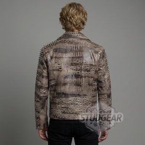 Rear view of spiked shoulders on beige and brown leather motorcycle jacket